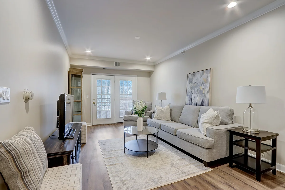 fully-furnished, elegant living room area in apartment at Newcastle Place Senior Living Community