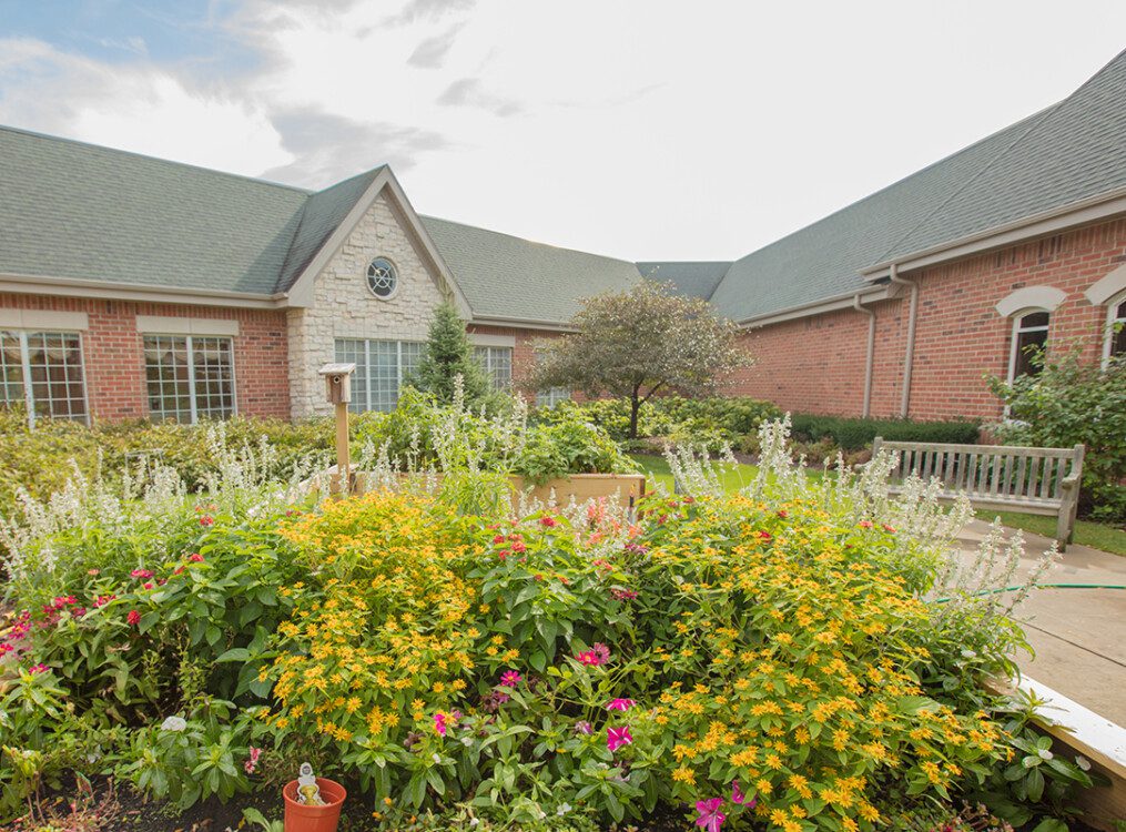 view of the beautiful landscaping and courtyard setting at Newcastle Place Senior Living Community in Mequon, WI